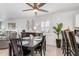 Dining area with a dark wood table, chairs, and a ceiling fan at 175 Kings Hwy # 718, Punta Gorda, FL 33983