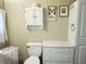 Bathroom with toilet and white storage cabinet at 5524 Holiday Park Blvd, North Port, FL 34287