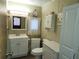 Clean bathroom with white vanity and storage cabinet at 5524 Holiday Park Blvd, North Port, FL 34287