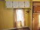Kitchen with window and beige curtains at 5524 Holiday Park Blvd, North Port, FL 34287