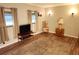 Bright living room with hardwood floors and a comfy seating area at 5524 Holiday Park Blvd, North Port, FL 34287