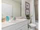 Clean bathroom with single sink, shower/tub combo, and updated vanity at 1051 Adalia Ter, Port Charlotte, FL 33953