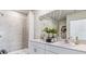 Elegant bathroom boasts double sinks, a large shower, and modern finishes at 1051 Adalia Ter, Port Charlotte, FL 33953