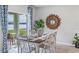 Bright dining room with lake view and rustic table at 1051 Adalia Ter, Port Charlotte, FL 33953