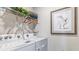Convenient laundry room with washer, dryer, and overhead shelving at 1051 Adalia Ter, Port Charlotte, FL 33953