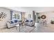 Bright living room with comfy sofas, coffee table, and large window at 1051 Adalia Ter, Port Charlotte, FL 33953