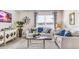 Living room features a large window, comfy sofas, and stylish decor at 1051 Adalia Ter, Port Charlotte, FL 33953