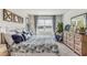 Main bedroom with king-size bed and dresser, overlooking a lake at 1051 Adalia Ter, Port Charlotte, FL 33953