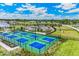 Well-maintained pickleball courts with surrounding green space at 1425 Powell Valley Dr, Port Charlotte, FL 33953