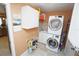 Bright laundry room with washer, dryer, and storage at 1 Colony Point Dr # B9, Punta Gorda, FL 33950