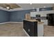 Modern kitchen with white cabinets, granite counters, and black appliances at 17152 Wintergarden Ave, Port Charlotte, FL 33948