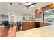 Open kitchen boasts granite counters, modern appliances, and rich wood cabinetry at 240 Divinci Dr, Punta Gorda, FL 33950