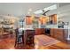 Modern kitchen with wood cabinets, granite counters, and breakfast bar at 240 Divinci Dr, Punta Gorda, FL 33950