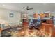 Bright living room with hardwood floors, open floor plan, and access to kitchen at 240 Divinci Dr, Punta Gorda, FL 33950