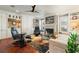 Relaxing living room with hardwood floors, built-in shelving, and a fireplace at 240 Divinci Dr, Punta Gorda, FL 33950