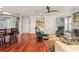 Open living space with hardwood floors, built-in shelving, and comfortable seating at 240 Divinci Dr, Punta Gorda, FL 33950
