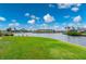Waterfront property with lush green grass and canal views at 1457 Sea Fan Dr, Punta Gorda, FL 33950