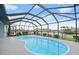 Enclosed kidney-shaped pool with a glass roof at 1457 Sea Fan Dr, Punta Gorda, FL 33950