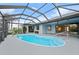 Enclosed kidney-shaped pool with a glass roof at 1457 Sea Fan Dr, Punta Gorda, FL 33950