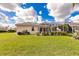 Spacious backyard with screened enclosure and lush lawn at 2970 Royal Palm Dr, North Port, FL 34288