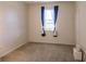 Spacious bedroom with neutral walls and carpet at 2970 Royal Palm Dr, North Port, FL 34288