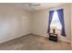 Well-lit bedroom featuring a ceiling fan and side table at 2970 Royal Palm Dr, North Port, FL 34288
