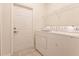 Laundry room with washer, dryer, and additional storage at 2970 Royal Palm Dr, North Port, FL 34288
