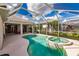 Refreshing pool and spa with a screened enclosure, perfect for outdoor enjoyment at 2970 Royal Palm Dr, North Port, FL 34288