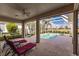 Relaxing screened-in pool and spa area with lounge chairs at 2970 Royal Palm Dr, North Port, FL 34288