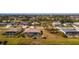 Aerial view of houses with pools in a residential community at 243 Fairway Rd, Rotonda West, FL 33947