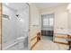 Renovated bathroom featuring a shower stall with white marble-like tiles at 440 Norma Ct, Punta Gorda, FL 33950