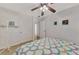 Bedroom with tiled floors and double doors leading to another room at 4555 Mckibben Dr, North Port, FL 34287