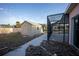 Backyard featuring a storage shed and screened pool enclosure for outdoor enjoyment at 1923 Pennsylvania Ave, Englewood, FL 34224