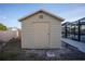 Simple storage shed for tools and equipment, located near the screened pool at 1923 Pennsylvania Ave, Englewood, FL 34224
