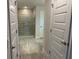 Bathroom with a walk-in shower and gray tile floors at 10225 Winnipeg St, Port Charlotte, FL 33981