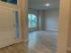 Bright entryway with tile floors and a large window at 10225 Winnipeg St, Port Charlotte, FL 33981