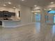 Open concept kitchen and living area with tile floors at 10225 Winnipeg St, Port Charlotte, FL 33981