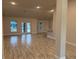Spacious living room with tile floors and access to the backyard at 10225 Winnipeg St, Port Charlotte, FL 33981