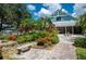 Landscaped courtyard with seating area, shows community amenities at 19310 Water Oak Dr # 201, Port Charlotte, FL 33948