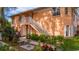 Exterior view of condo building with landscaped grounds at 19310 Water Oak Dr # 201, Port Charlotte, FL 33948