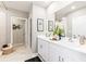 Modern bathroom with double vanity and walk-in shower at 5096 Schubert Trl, North Port, FL 34287