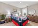 Baseball-themed bedroom with full-size bed, dresser, and window seating at 5096 Schubert Trl, North Port, FL 34287