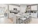 Modern kitchen with white cabinets, stainless steel appliances, and kitchen island at 5096 Schubert Trl, North Port, FL 34287