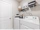 Laundry room with washer, dryer, and shelving at 5096 Schubert Trl, North Port, FL 34287
