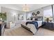 Spacious main bedroom with plush king-size bed, and large windows at 5096 Schubert Trl, North Port, FL 34287