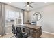 Home office with L-shaped desk and two chairs at 5096 Schubert Trl, North Port, FL 34287