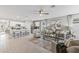 Open floor plan with living room, kitchen island, and neutral decor at 5096 Schubert Trl, North Port, FL 34287