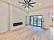 Bright living room features a fireplace and sliding doors leading to the backyard at 2925 Woodward Ave, North Port, FL 34286