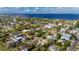 An aerial shot of a teal home, surrounded by lush tropical foliage at 350 Gill St, Punta Gorda, FL 33950