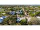 An aerial view of a teal home with a gray roof in a residential area at 350 Gill St, Punta Gorda, FL 33950